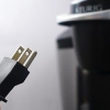 Die skoonmaak van 'n keurig-koffiemaker met asyn