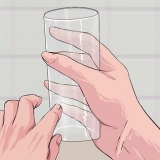 Verwyder afsettings van glase
