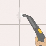 Maak die grout in jou badkamer skoon