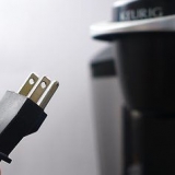 Die skoonmaak van 'n keurig-koffiemaker met asyn