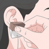 Verminder pyn wat veroorsaak word deur 'n nuwe piercing
