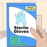 Sit steriele handskoene aan