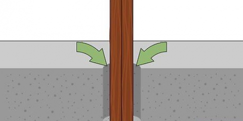 Die plaas van 'n hout heiningpaal