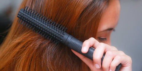 Maak haarstyle met 'n gedraaide knop