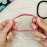 Naaldwerk van 'n scrunchie
